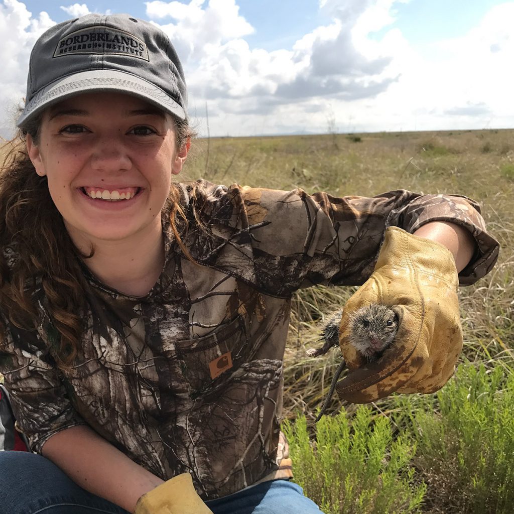 Student holding rodent Student holding rodent
